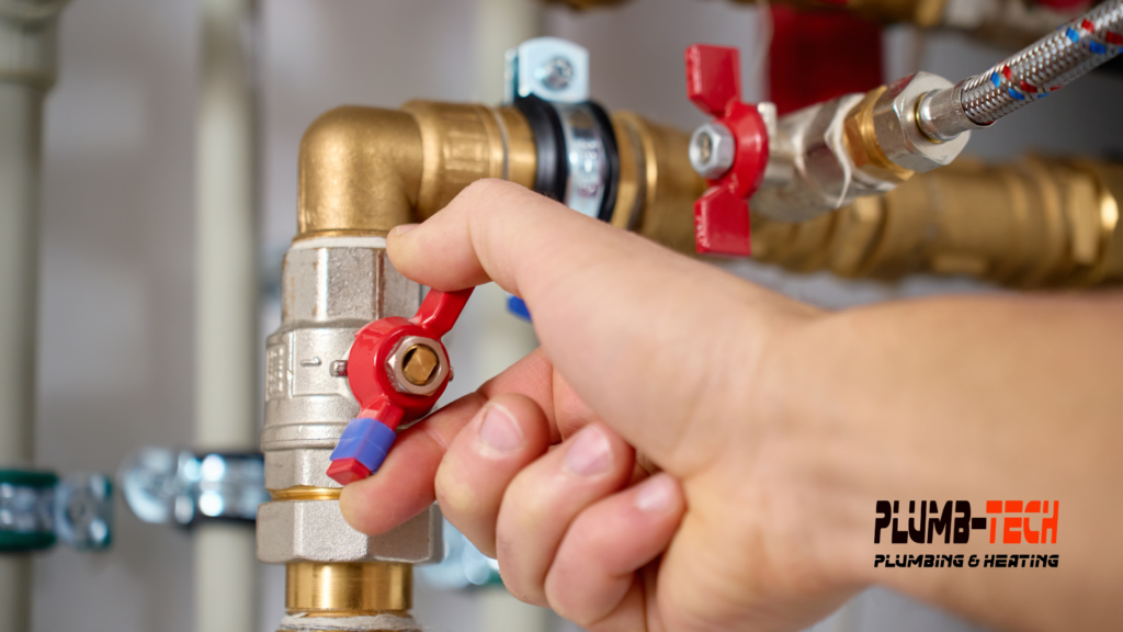 hand turning off main water valve